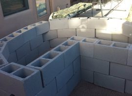 The best way to secure a heavy masonry planter to a concrete pedestal.